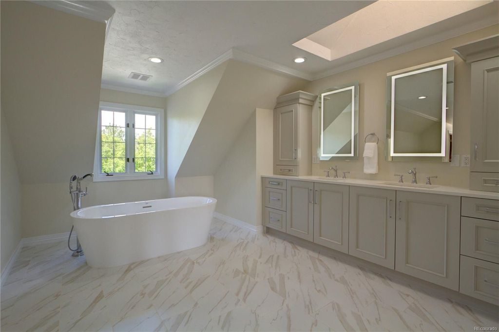 Bath Cabinets in a modern bathroom showcasing freestanding styles for functional storage and elegant design.